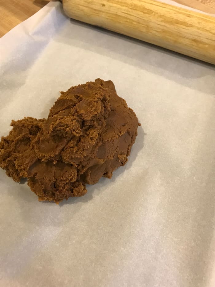 This is a nice dough—no flour required for rolling. But I do like working on parchment. This means you can cut the cookies out and slide the parchment onto a baking sheet when ready, keeping the ornament shapes intact.