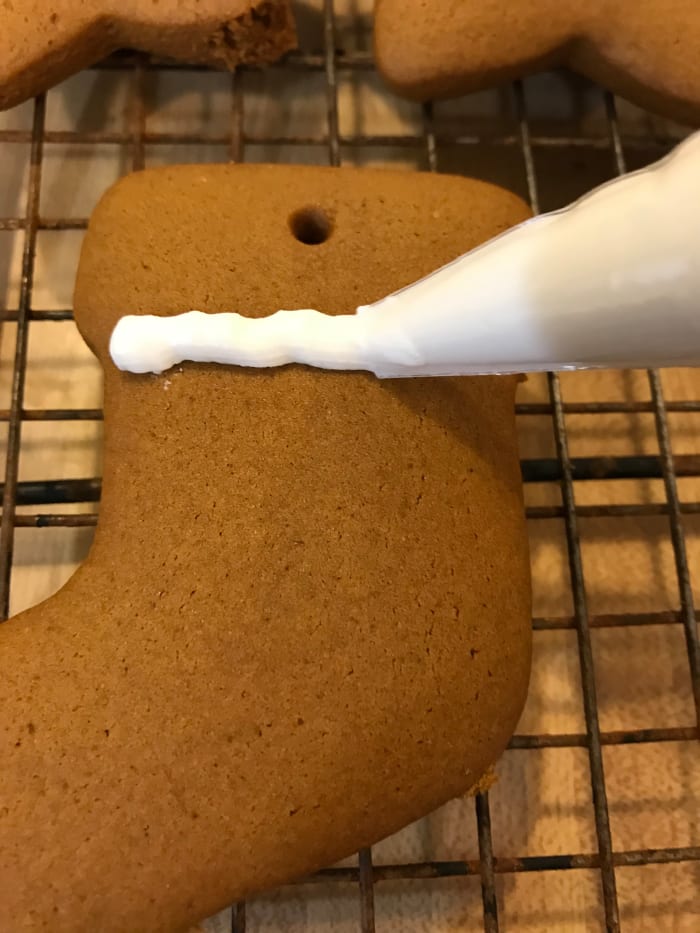 Once the cookies are baked, it's time to decorate! Royal icing is easy to pipe (see, I didn't even use a piping tip), holds its shape beautifully, and drys very hard. No icing mess on the finished cookies!