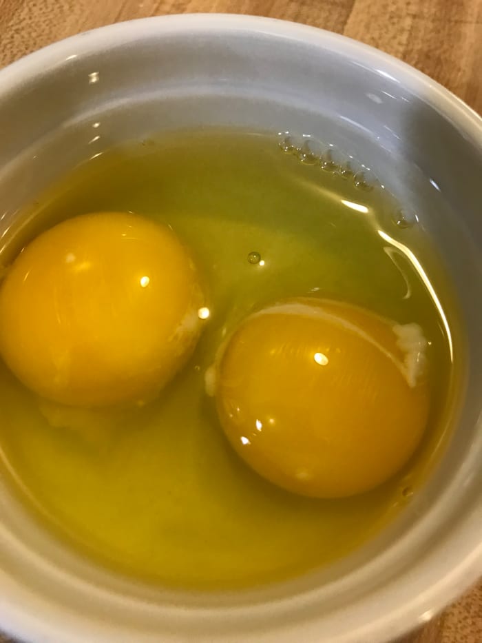 I like to start the mixer and let the sugar/butter mixture cool a bit before adding the eggs, so the eggs don't cook in the dough. Use large eggs at room temperature.
