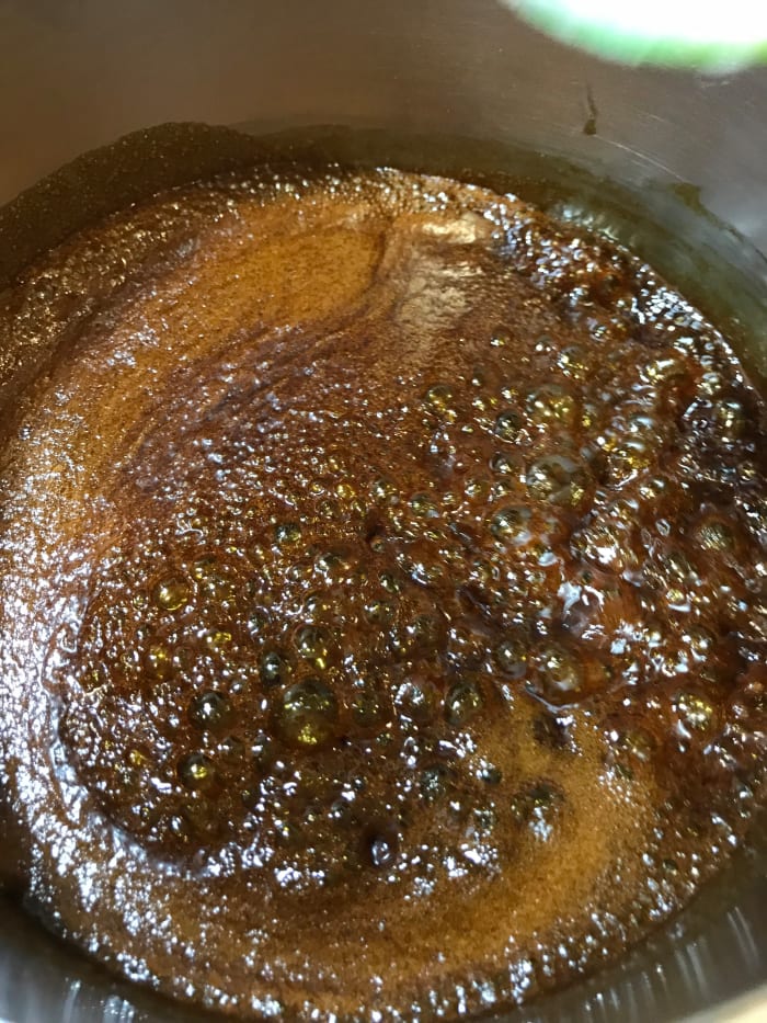 Bring the sugar and spices to a boil, and let it boil for just a minute. All you need to do here is dissolve the sugar. Be careful— boiling sugar is dangerous, and if it hits your skin, you'll NOT have a Merry Christmas.