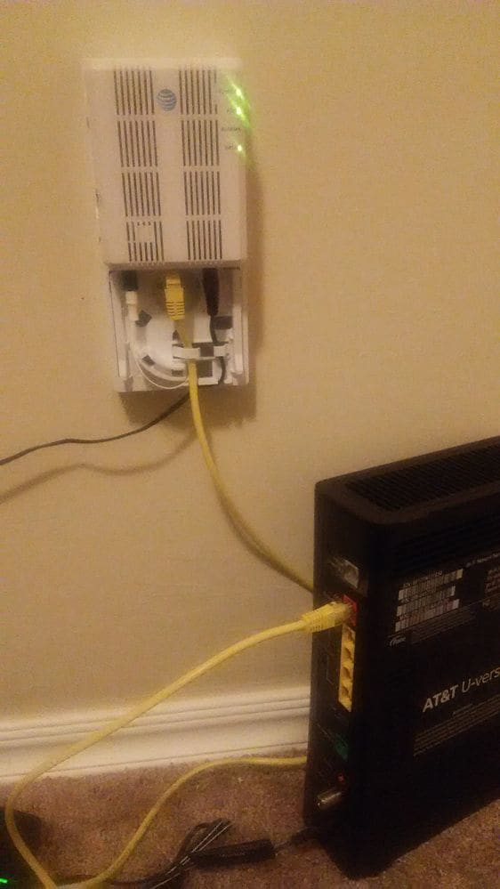 This is the ONT that decodes all those pretty blinking lights. Once the signal is decoded, it leaves on the yellow ethernet going to the modem.