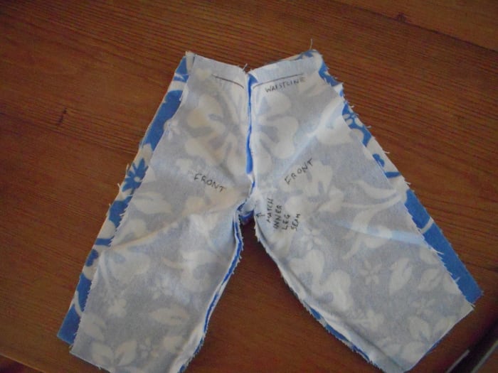 Until you end up with a pair of inside-out pajama bottoms. Check that you have a waistband on top and two long side seams. Note that the center seam runs front-to-back around the crotch.