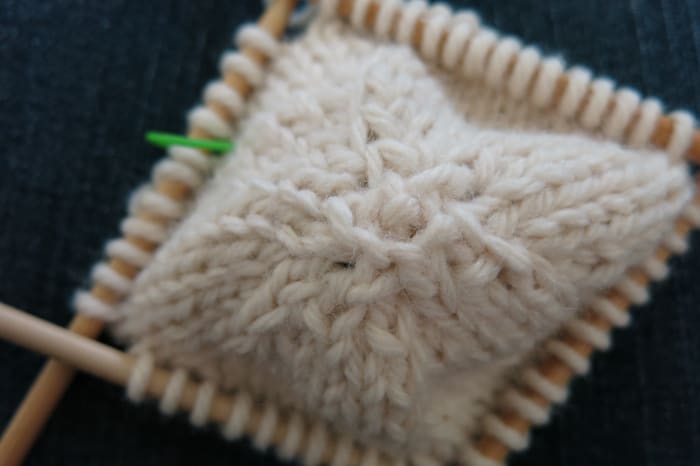 Use your cast on tail to darn up any hole from the start of your snowman ornament.