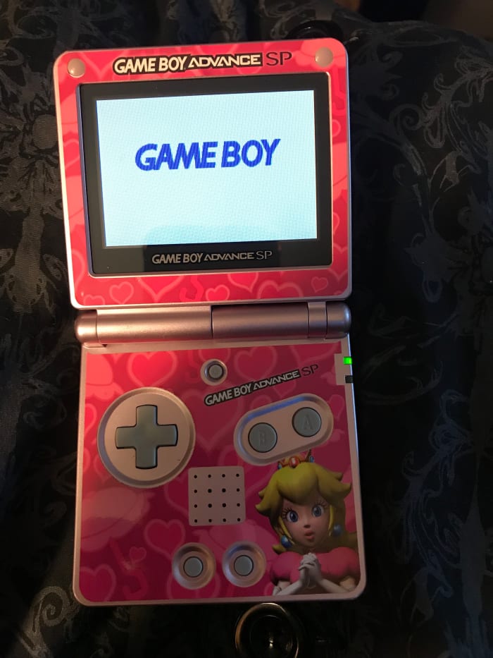 This GBA game gets stuck on the "Game Boy" screen, and won't load. It may need to be cleaned.