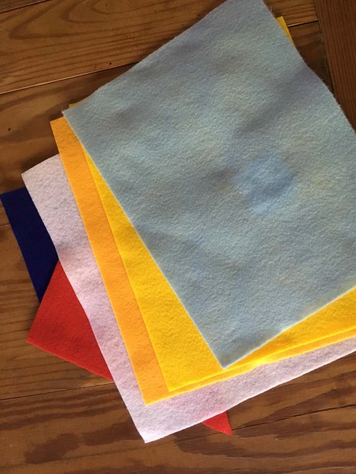 For the blue felt background on Toodles' front and back, it would be good to purchase a larger piece of felt that would not have to be pieced together.