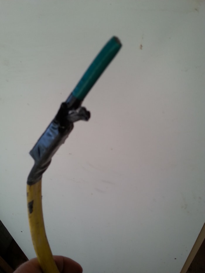 To feed the satellite internet cable through my wall cavity, the technician used a flat packing strip taped to a short piece of garden hose. Job done.
