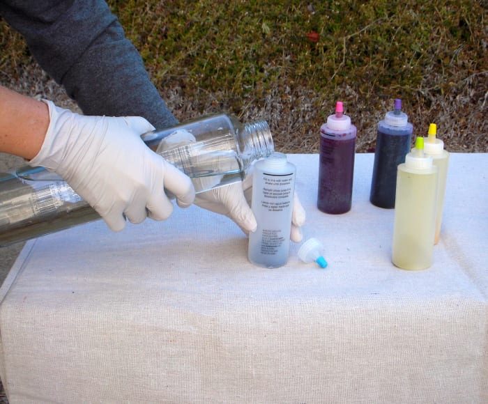 Add water to each dye bottle to fill line. Shake vigorously until no powder is visible at the bottom of the dye bottle.