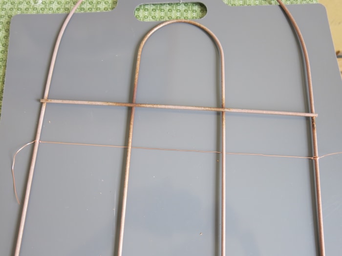 attaching wire to my fence piece to use it as a bulletin board or jewelry organizer