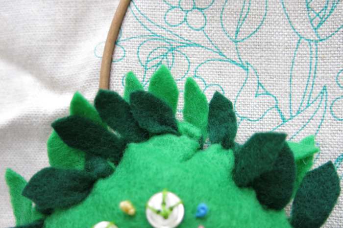 To finish your no-sew pincushion, cut each piece of fringe to look like a flower petal.