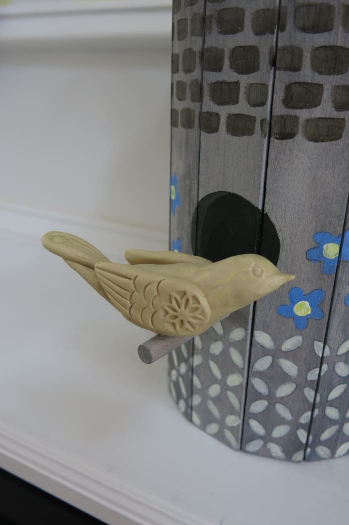 You can add a small decorative bird to complete your birdhouse planter or flower vase.