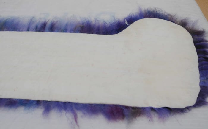 Cover the white layer in fibers which have been pulled from the lengths of roving as per normal procedure.