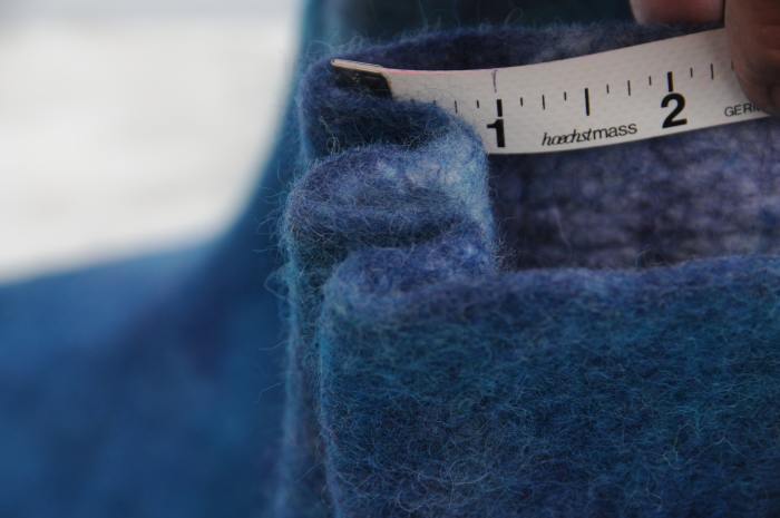 Depth of fold is approximately 1 inch. Put the boots on your feet to check that the folds fit neatly around the foot.