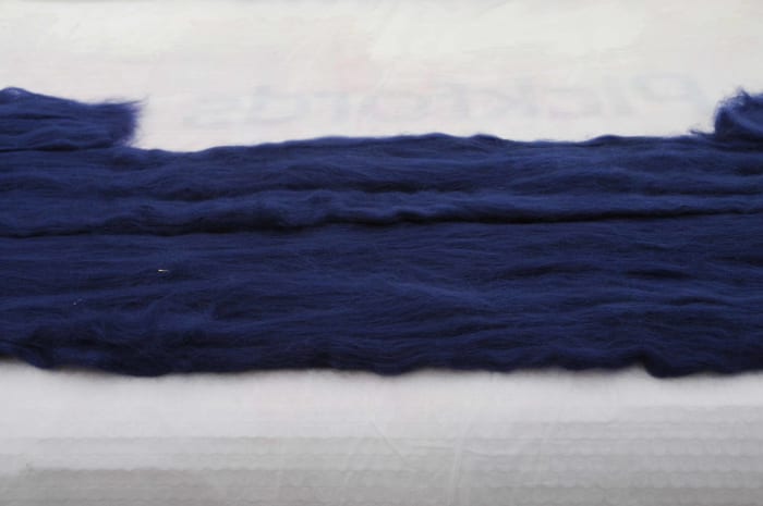 Pull out the fibers from lengths of roving and put down onto the template, repeat on the other side.