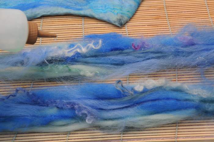 The split roving with a little embellishment - making 2 ties and being made wet with soapy water.