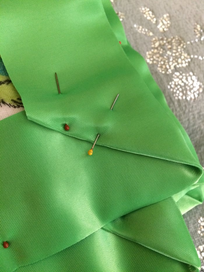 Use as many straight pins as necessary to secure your blanket binding. This will allow you to have straight machine stitching.