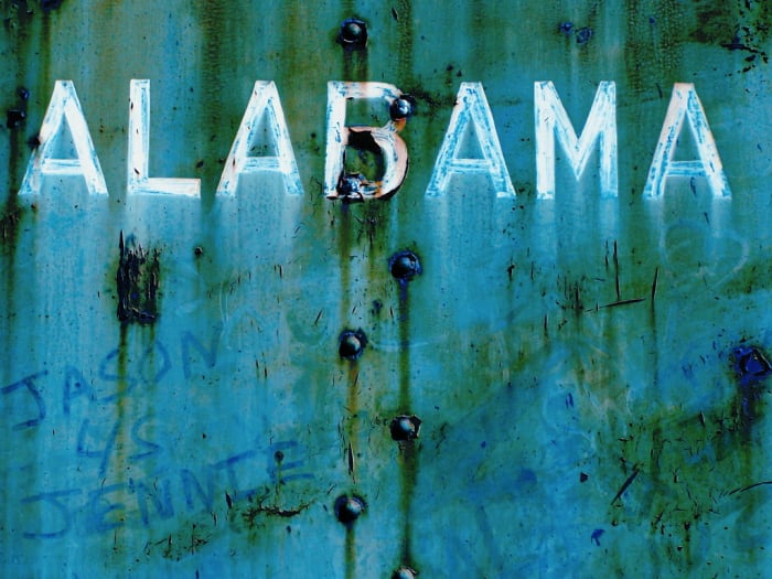 ALABAMA I cannot control my photographic impulses when industrial locations are involved. In an old train yard in Calera, Alabama there is a goldmine of imagery just waiting for a camera. This is a photograph of a train car, complete with graffiti.