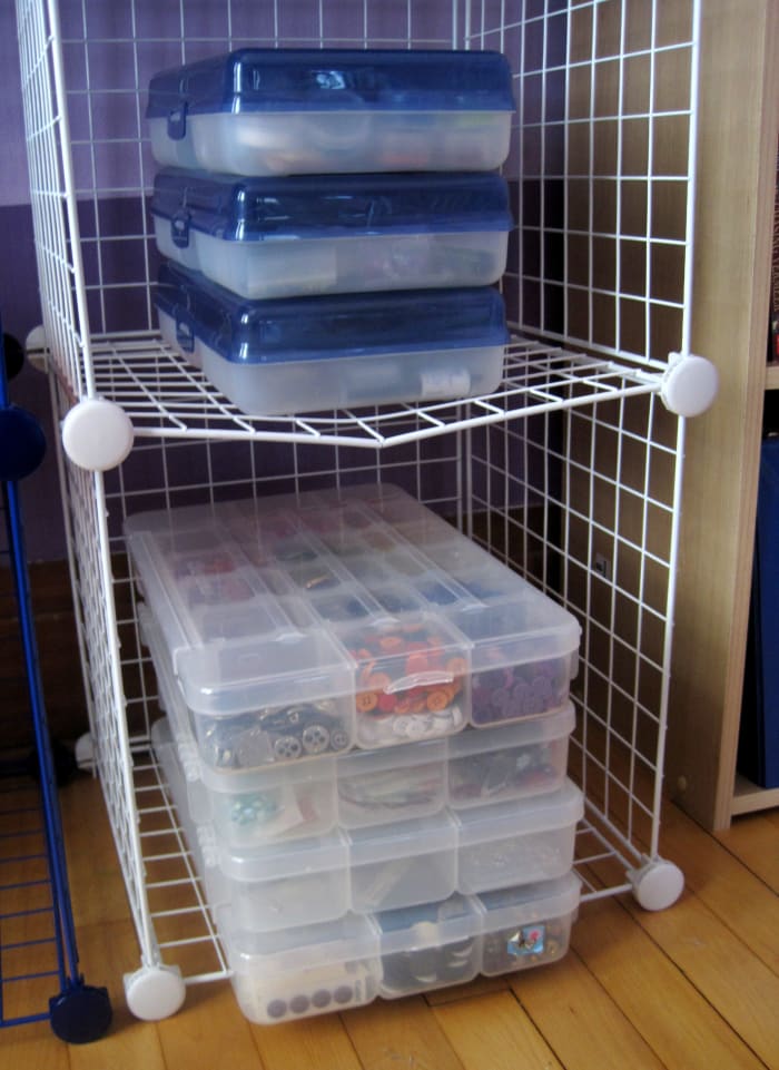 I store all of my beads, buttons, and findings in plastic craft organizers or plastic containers.