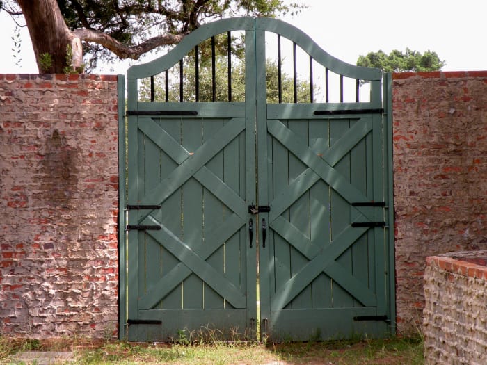 Gates and doors were all designed by Anna. This one is in the entry courtyard and opens out onto grassy lawns.