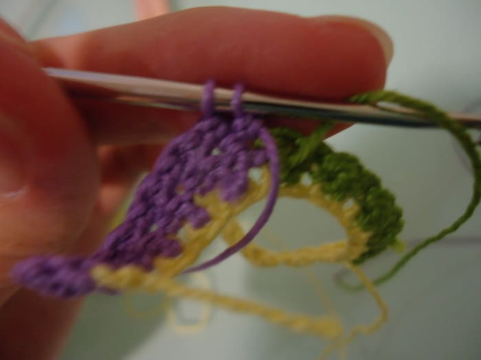 Time to change colors! Just before the last stitch of the previous color is completed, yarn over with the new color and pull through all the final loops.