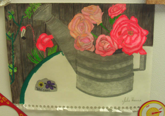 Here I completed coloring in the welcome sign, and I am beginning to color in the green table cloth.