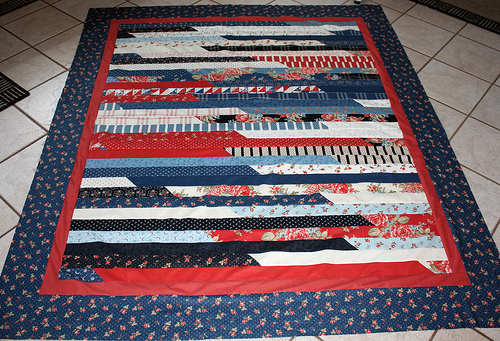 This quilt is made of jelly roll strips, so you do not have to do much cutting, and is easy to piece together quickly.