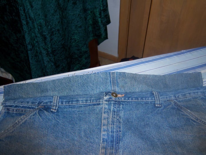The joining piece sewn to the flap. If you left the button, use care when using the sewing machine, or skip that area around the button and sew by hand.