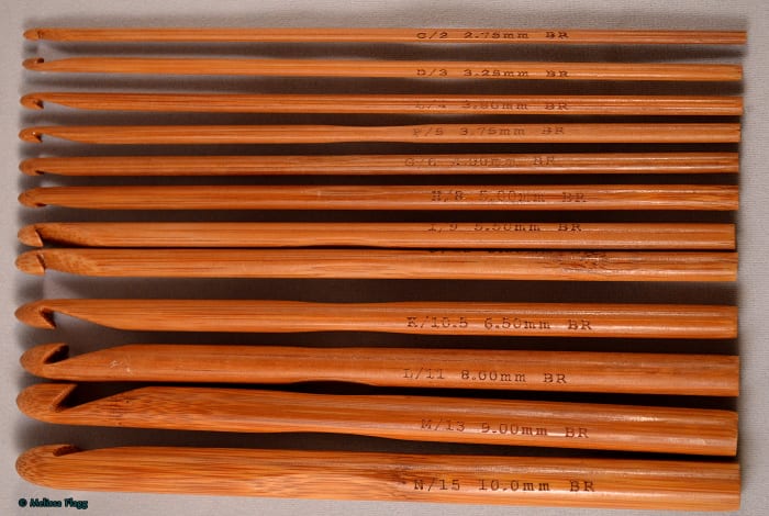 Crochet hook sizes P to A from left to right. As the alphabet progresses the hook size gets bigger. Hook size A is smaller than size B and so on.