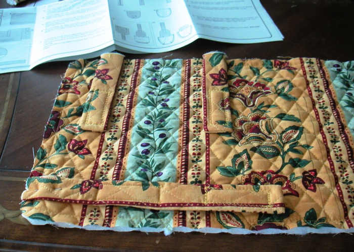 After the straps are turned right side outward, Velcro is added and the straps are attached to the main body of the bag.