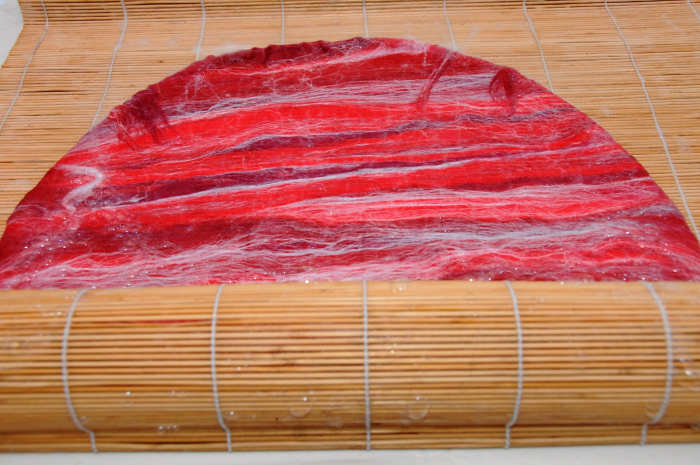 Roll inside a bamboo blind and rotating the direction in which you roll the project.