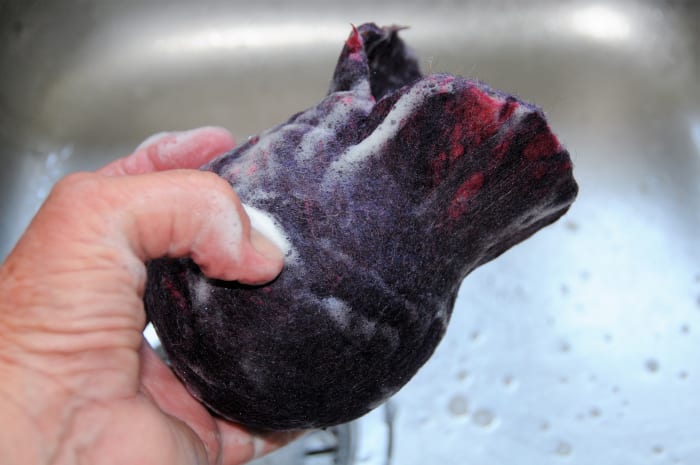 The fiber around the opening has been left deliberately so that the large ball can easily be removed.