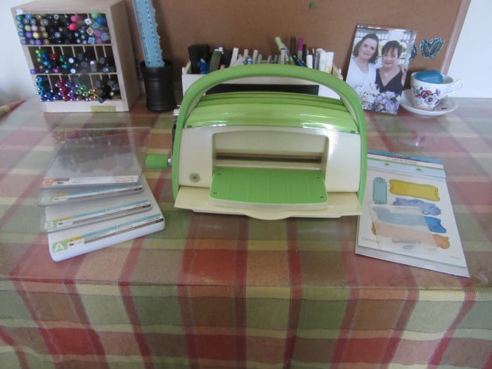 The cuttlebug is one type of manual machine. It uses a handle to move the plates, paper and die. The plates are compressed in the machine which forces the die onto the paper.making the cut