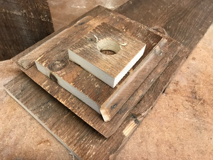 The front, roof and side sections were cut from a section of worn and weathered barn wood. The back and floor sections were cut from salvaged shiplap pine.
