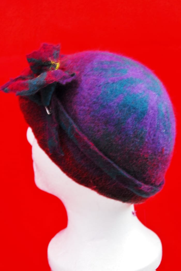 Completed hat still wet but showing the side view with matching flower and hat band