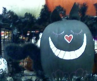 All is not lost! It appears that some marketer is trying to improve the image of black cats by preparing this lovable black pumpkin cat decoration.