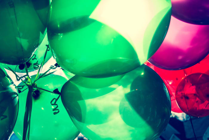 Balloons are a fun and inexpensive decoration. But take care that too many balloons on the floor leads to loud popping and overstimulation. Be mindful this may be upsetting to young toddlers.
