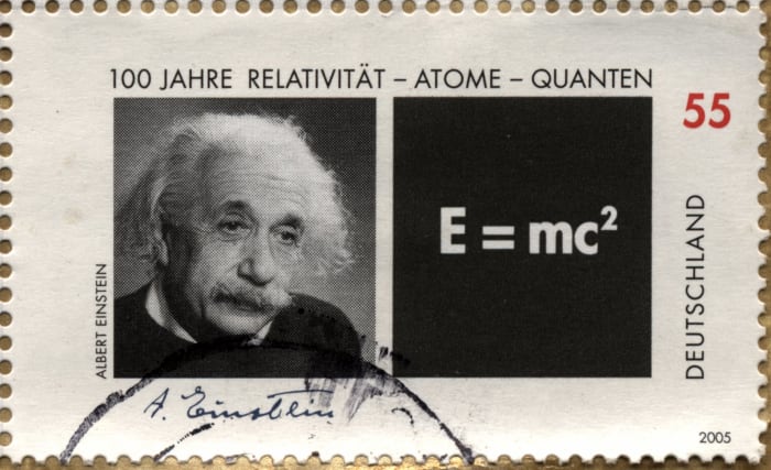 This aged stamp shows Einstein next to his most recognizable equation—the equation of mass-energy equivalence.