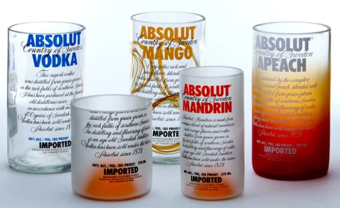 Make cool drinking glasses from empty bottles as a gift for a guy. Use an inexpensive glass cutter to make them look perfect.