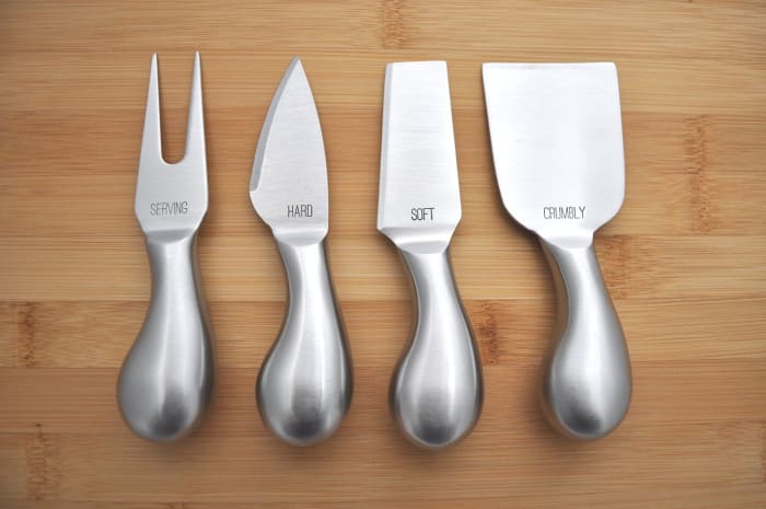 Labeled cheese knives are the perfect accessory for a party or get together, but most people don't own a set, making it a great Secret Santa gift.