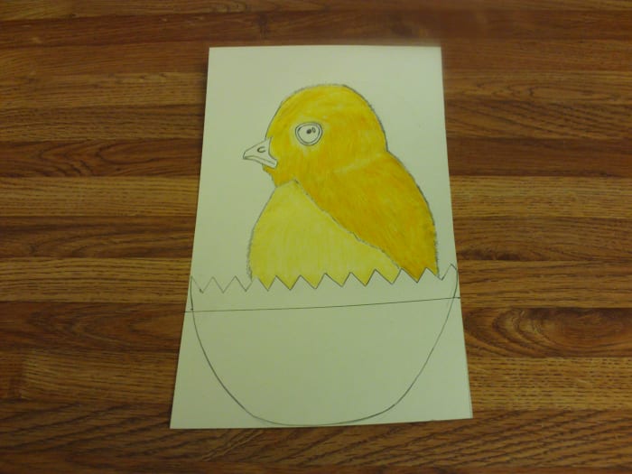 In this photograph you can see I have shaded in the darker gold portions of the baby chick's fur.