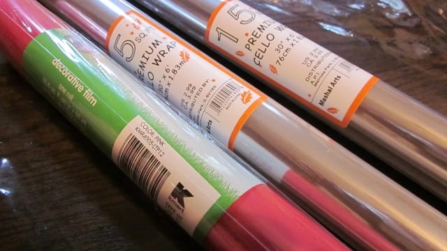 Clear and color-tinted plastic gift wraps completes the look of a professional gift basket.