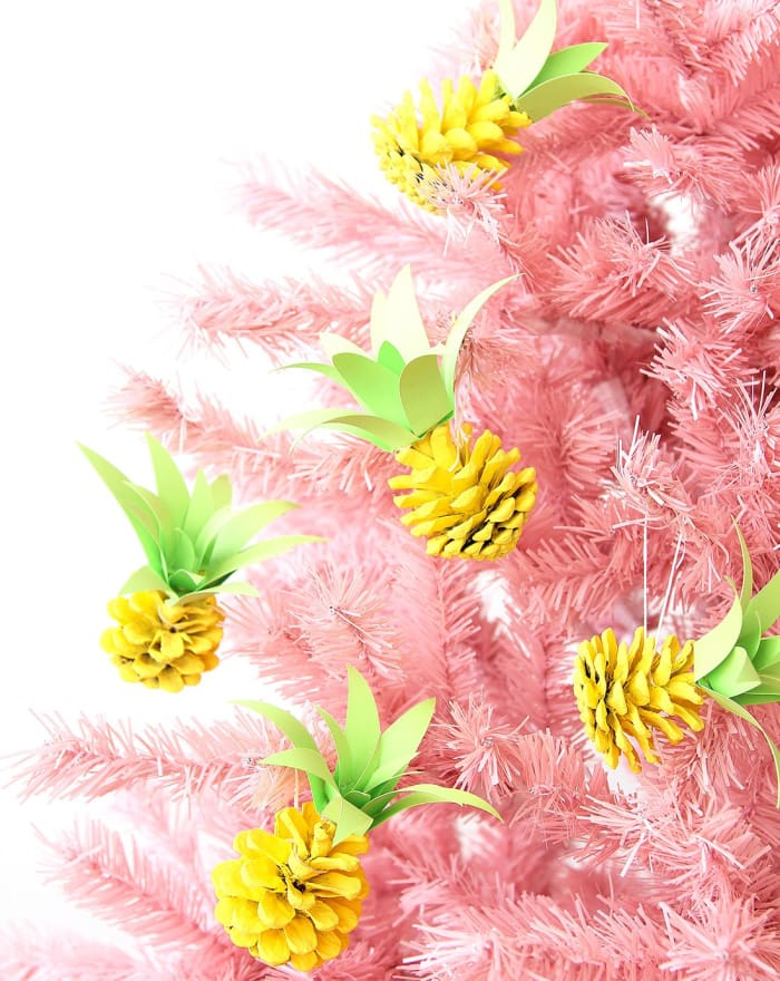 If you want to brighten up your Christmas tree for the holidays, but traditional ornaments are not your style, these cute pine-cone pineapples are for you.