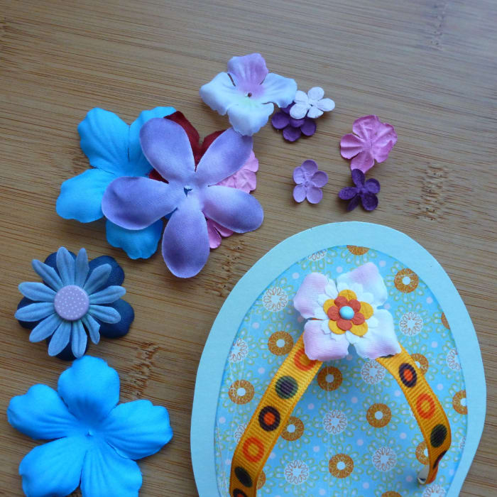 Adding floral embellishments to the shoe card handmade DIY flip flop cards to make.