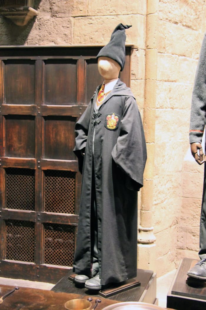 You can opt to wear a wizard's hat over your hair, but these were only seen in the first movie.