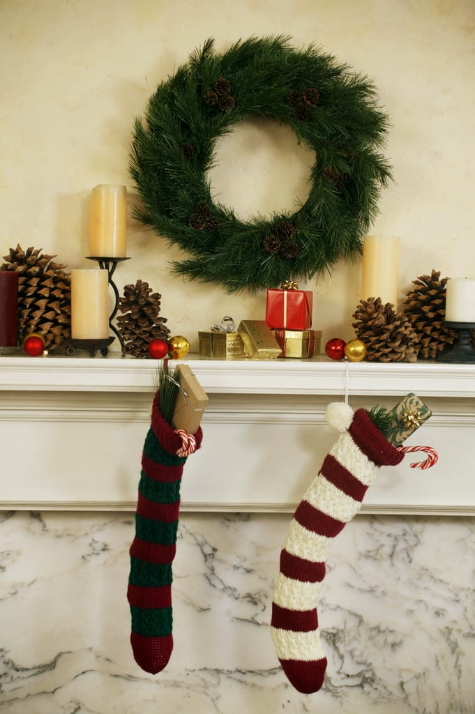 If you aren't putting up a Christmas tree this year, a large wreath hanging over your mantel can serve as a fragrant stand-in for a live tree.