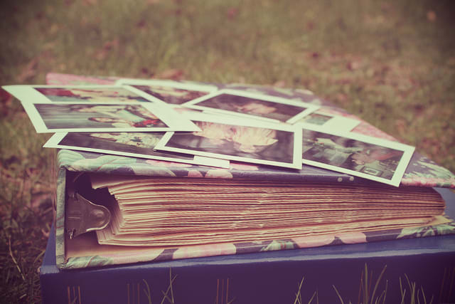 Collecting old photos or printing off digital photos to make a photo album is a wonderful keepsake gift exchange idea for any family member.