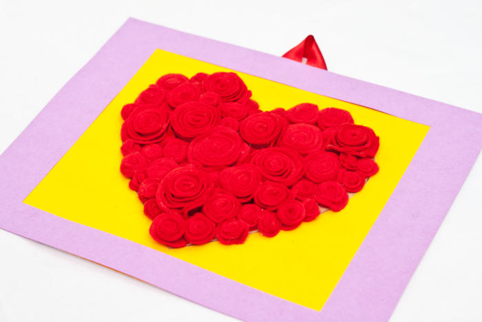 Step 13: Your heart shaped rose art is now ready to hang or be given away as a Valentine's Day gift. Now step back and take a look... your beautiful, homemade work of art is done!