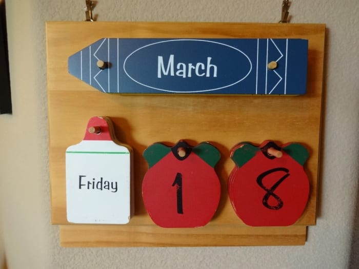 This perpetual calendar with changeable days, dates and months helps keep the resident in the present.