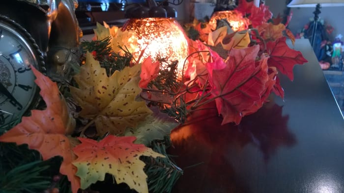 This brightly colored fall garland and light glob easily blends with Christmas decor later on.