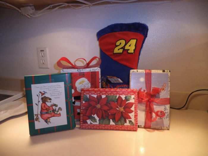 When I'm mailing gifts, I usually skip the bows which get crushed in the mail. Instead, I decorate the package with colorful cards and tie with a ribbon or yarn.