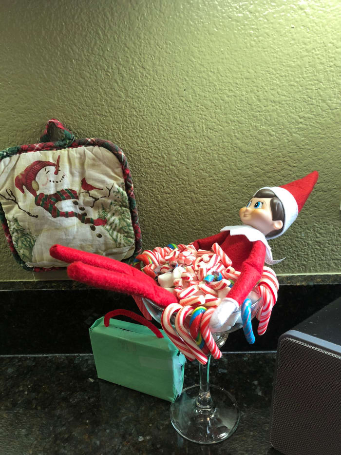 Our elf has arrived! With suitcase in tow and a bath of candy canes, our elf has arrived for the Christmas season. (This was from last year)